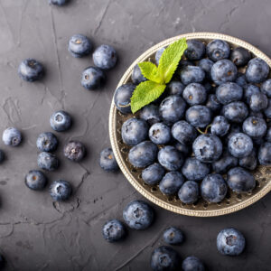 group-ripe-blueberries-metal-plate-with-mint-leaves